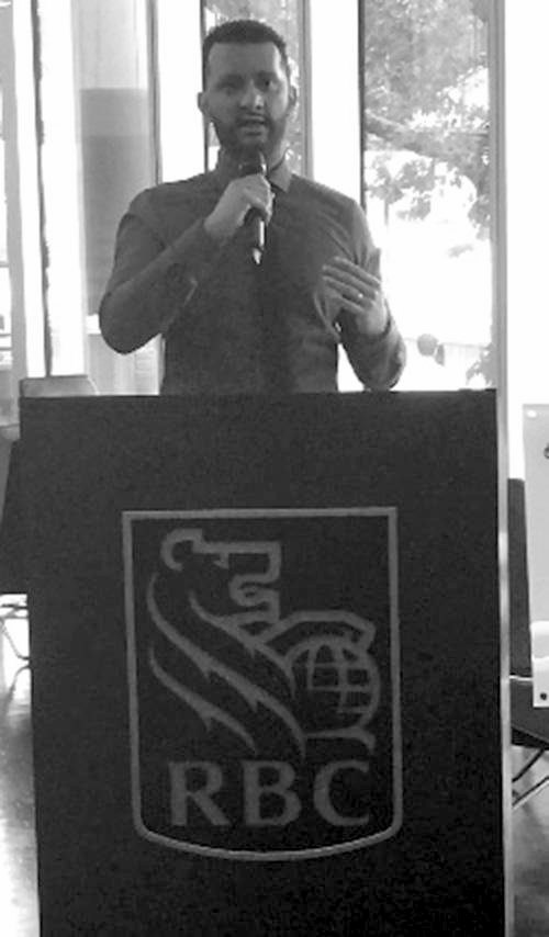 Michael Maven speaking at a lectern at Royal Bank of Canada, London